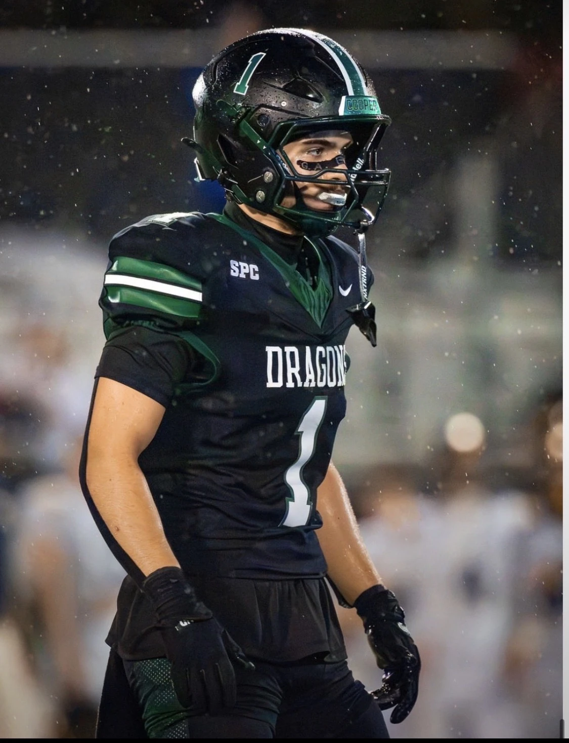 Hudson Voss in his black and green football uniform on the field